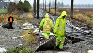 Cleanup crews remove debris after rainstorms lashed the western Canadian province, triggering landslides and floods, shutting highways, in Abbotsford, British Columbia, Canada November 30, 2021. REUTERS/Jennifer Gauthier/File Photo