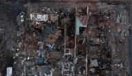 Businesses, including the The Bloom Company, are leveled in the aftermath of a tornado in Mayfield, Kentucky, U.S. December 13, 2021. Picture taken with a drone. REUTERS/Adrees Latif
