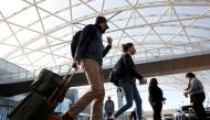 Passengers depart Hartsfield-Jackson Atlanta International Airport in Atlanta, Georgia, U.S., November 23, 2020. REUTERS/Chris Aluka Berry/File Photo