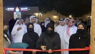 Nama Executive Director Saba Al Fadala cutting the ribbon to mark the opening of Nama Winter Carnival in Souq Wakra, yesterday. Also seen are Nama officials and ExxonMobil representative, which is the platinum sponsor of the event.  Pic: Joelyn Baluyut/The Peninsula