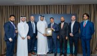 Thani Ali Al Malki, Executive Director Business, Ooredoo Qatar, receiving the award from Cisco at en event in Doha.  