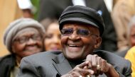 Archbishop Desmond Tutu laughs as crowds gather to celebrate his birthday by unveiling an arch in his honour outside St George's Cathedral in Cape Town, South Africa, October 7, 2017. Reuters/Mike Hutchings/File Photo