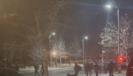 Officers gather in the street, in Lakewood, Colorado, U.S., December 27, 2021 in this still image taken from a social media video. Hawk Hawkins/via REUTERS