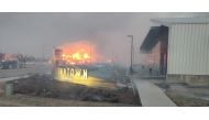 Wildfires are seen near the Tesla building in Boulder County in Colorado, U.S., December 30, 2021. Picture taken December 30, 2021 in this still image obtained from social media. Instagram@sunshinefire.boulder.colorado/via REUTERS