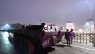 An armoured personnel carrier is seen near the mayor's office during protests triggered by fuel price increase in Almaty, Kazakhstan January 5, 2022. REUTERS.