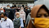 People wearing protective masks walk through a platform of a train station during the afternoon rush hours as the Omicron variant continues to spread, amid the coronavirus disease (Covid-19) pandemic, in Jakarta, Indonesia, January 3, 2022. Reuters/Willy Kurniawan/File Photo