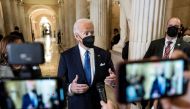 U.S. President Joe Biden speaks to reporters in the Hall of Columns on the one-year anniversary of the January 6, 2021 attack on the Capitol in Washington, U.S., January 6, 2022. Ken Cedeno/Pool via REUTERS
