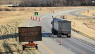 FILE PHOTO: Manitoba-based truckers, transporting goods to and from the United States, are being vaccinated against coronavirus disease (COVID-19) as part of a deal between the Canadian province and the state of North Dakota, at a rest stop near Drayton, North Dakota, U.S. April 22, 2021. REUTERS/Dan Koeck/File Photo
