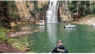 Firefighters of Minas Gerais state search for victms after a wall of rock collapsed on top of motor boats below a waterfall in Capitolio, in Minas Gerais state, Brazil January 8, 2022. Fire Brigade of Minas Gerais/Handout via REUTERS