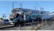 A train hits an aircraft that crashed on railway tracks in Los Angeles, California, U.S. January 9, 2022 in this screen grab from a social media video obtained by Reuters. Luis Jimenez/via REUTERS