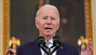FILE PHOTO: U.S. President Joe Biden delivers remarks on the December 2021 jobs report during a speech in the State Dining Room at the White House in Washington, U.S., January 7, 2022. REUTERS/Kevin Lamarque/File Photo
