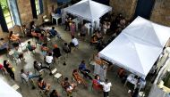 People wait to receive medical attention and to be tested for the coronavirus disease (COVID-19) at Princess Isabel Palace, where a healthcare unit specialising in COVID-19 and flu symptoms has been set up, in Rio de Janeiro, Brazil January 12, 2022. REUTERS/Lucas Landau/File Photo