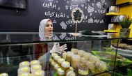 Hana Al-Wakeel, prepares sweets at her 