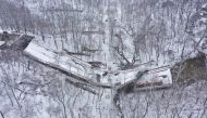 Damaged vehicles are seen at the site of a collapsed bridge in Pittsburgh, Pennsylvania, U.S., January 28, 2022. Picture taken with a drone. REUTERS/Drone Base