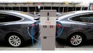 Tesla Model X electric cars recharge their batteries in Berlin, Germany, November 13, 2019. Reuters/Fabrizio Bensch//File Photo