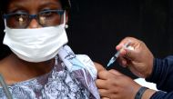 A healthcare worker administers the Johnson and Johnson coronavirus disease (COVID-19) vaccination to a woman in Houghton, Johannesburg, South Africa, August 20, 2021. REUTERS/ Sumaya Hisham/File Photo/File Photo