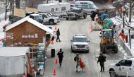 Police and city crew members start putting up a fence around the temporary soup kitchen in a park, as truckers and supporters continue to protest coronavirus disease (COVID-19) vaccine mandates, in Ottawa, Ontario, Canada, February 6, 2022. REUTERS/Lars Hagberg
