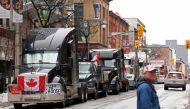 Vehicles queue on Bank Street as truckers and supporters continue to protest Covid-19 vaccine mandates, in downtown Ottawa, Ontario, Canada, February 9, 2022. Reuters/Blair Gable