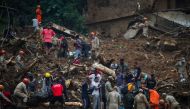 People carry bodies at a mudslide at Morro da Oficina after pouring rains in Petropolis, Brazil February 16, 2022. REUTERS/Ricardo Moraes