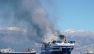 Smoke rises from the burning Italian-flagged Euroferry Olympia, after a fire broke out on the ferry, off the island of Corfu, Greece, February 18, 2022. REUTERS/Adonis Skordilis