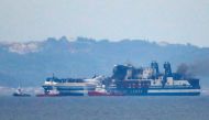 Smoke on the Italian-flagged Euroferry Olympia, which sailed from Greece to Italy early on Friday and caught fire, is seen from Sarande, Albania, February 20, 2022. REUTERS/Florion Goga