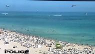A view of a helicopter before crashing into the ocean in Miami Beach, Miami, Florida, U.S., February 19, 2022, in this still image obtained from social media video. Courtesy of Miami Beach Police Department/@MiamiBeachPD/via REUTERS