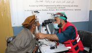 A beneficiary receiving treatment under Qatar Red Crescent Society (QRCS) medial project in Afghanistan.