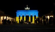 The Brandenburg Gate is illuminated in Ukrainian national colors, in Berlin, Germany February 23, 2022. REUTERS/Michele Tantussi
