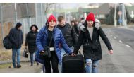 People flee from Ukraine at the Hungarian-Ukrainian border after Russian President Vladimir Putin authorized a military operation, in Beregsurany, Hungary, February 24, 2022. REUTERS/Bernadett Szabo


