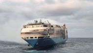 The ship, Felicity Ace, which was traveling from Emden, Germany, where Volkswagen has a factory, to Davisville, in the U.S. state of Rhode Island, burns more than 100 km from the Azores islands, Portugal, February 18, 2022. Portuguese Navy (Marinha Portuguesa)/Handout via REUTERS