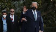 U.S. President Joe Biden waves to the media before boarding Marine One for travel to Delaware from the South Lawn of the White House in Washington, U.S., February 25, 2022. REUTERS/Leah Millis