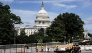 FILE PHOTO: Workers remove security fencing as a reduction in heightened security measures taken after the January 6th attack on the U.S. Capitol in Washington, U.S., July 10, 2021. REUTERS/Joshua Roberts


