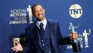 Actor Will Smith poses backstage with his awards for Outstanding Performance by a Male Actor in a Leading Role at the 28th Screen Actors Guild Awards, in Santa Monica, California, U.S., February 27, 2022. Reuters/Aude Guerrucci