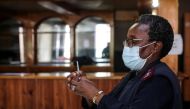 A healthcare worker prepares a dose of the Pfizer coronavirus disease (COVID-19) vaccine, amidst the spread of the SARS-CoV-2 variant Omicron, in Johannesburg, South Africa, December 9, 2021. REUTERS/ Sumaya Hisham


