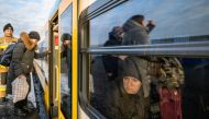 People fleeing Russia's invasion of Ukraine change trains at Euroterminal to be transferred to temporary accommodation centres around the country, in Slawkow, Poland March 5, 2022. Grzegorz Celejewski/Agencja Wyborcza