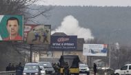 Smoke is seen after an artillery impact near a bridge, the only escape route used by locals to leave the town of Irpin, while Russian troops advance towards the capital, in Irpin, near Kyiv, Ukraine March 6, 2022. REUTERS/Carlos Barria