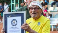 FILE PHOTO: The world's oldest tennis player Ukrainian Leonid Stanislavskyi, 97, takes part in an award ceremony of the Guinness World Record certificate in Kharkiv, Ukraine July 7, 2021. Picture taken July 7, 2021. REUTERS/Vyacheslav Madiyevskyy

