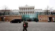 FILE PHOTO: A member of Austrian armed forces walks past Palais Coburg, the site of a meeting of the Joint Comprehensive Plan of Action (JCPOA), in Vienna, Austria, February 8, 2022. REUTERS/Leonhard Foeger