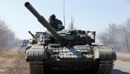 A view shows a convoy of pro-Russian troops during Ukraine-Russia conflict outside the separatist-controlled town of Volnovakha in the Donetsk region, Ukraine March 12, 2022. REUTERS.