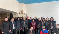 Local resident Teimur Aliev poses with his team of volunteers that deliver food and aid, amid the Russian invasion, in Kharkiv, Ukraine in this undated handout image obtained March 12, 2022. Teimur Aliev/Handout via REUTERS