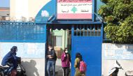 Students walk at the entrance of a public school in Beirut, Lebanon February 23, 2022. Picture taken February 23, 2022. REUTERS/Mohamed Azakir