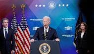 U.S. President Joe Biden is flanked by Secretary of State Antony Blinken and Deputy Secretary of Defense Kathleen Hicks as he speaks about assistance the U.S. government is providing to Ukraine amid Russia's invasion of the neighboring country, before signing an executive order on the aide in the Eisenhower Office Building's South Court Auditorium at the White House in Washington, U.S., March 16, 2022. REUTERS/Tom Brenner
