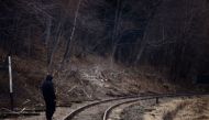 A man walks near railway tracks after crossing the border between Poland and Ukraine, after fleeing the Russian invasion of Ukraine, in Kroscienko. Reuters photo