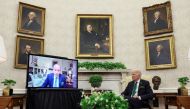 U.S. President Joe Biden hosts a virtual St. Patrick's Day visit with Ireland's Prime Minister Micheal Martin after Irish Taoiseach Martin tested positive for coronavirus disease (COVID-19) after arriving in Washington, in the Oval Office of the White House in Washington, U.S., March 17, 2022. REUTERS/Leah Millis
