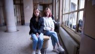 Ukrainian teenagers Sasha and Masha Litkovska pose for Reuters at Jean de la Fontaine High School, after fleeing from Ukraine to France, following Russia's invasion of Ukraine, in Paris, France, March 17, 2022. REUTERS/Yiming Woo