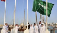 Ambassador H H Prince Mansour bin Khalid bin Farhan Al Saud hoisting Kingdom of Saudi Arabia’s flag at Doha Corniche, near the Countdown Clock, yesterday. 