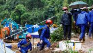 Rescue workers work at the site where a China Eastern Airlines Boeing 737-800 plane flying from Kunming to Guangzhou crashed, in Wuzhou, Guangxi Zhuang Autonomous Region, China March 24, 2022. REUTERS/Carlos Garcia Rawlins/File Photo