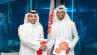 Deputy Group Chief Executive Officer and Chief Executive Officer of Ooredoo Qatar, Sheikh Mohammed bin Abdulla Al Thani and Mutaz Barshim after signing the agreement at Ooredoo headquarters.  