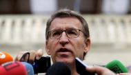 Galician President and member of the People's Party (PP) Alberto Nunez Feijoo talks to reporters outside a polling station after voting in Galician regional elections in Vigo, northern Spain, September 25, 2016. Reuters/Miguel Vidal/File Photo