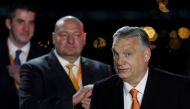 Hungarian Prime Minister Viktor Orban reacts in front of supporters after the announcement of the partial results of parliamentary election in Budapest, Hungary, April 3, 2022. Reuters/Bernadett Szabo